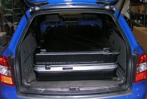 With the rear seats folded down, this huge case just fits inside the